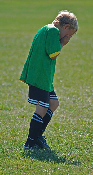 child sad soccer